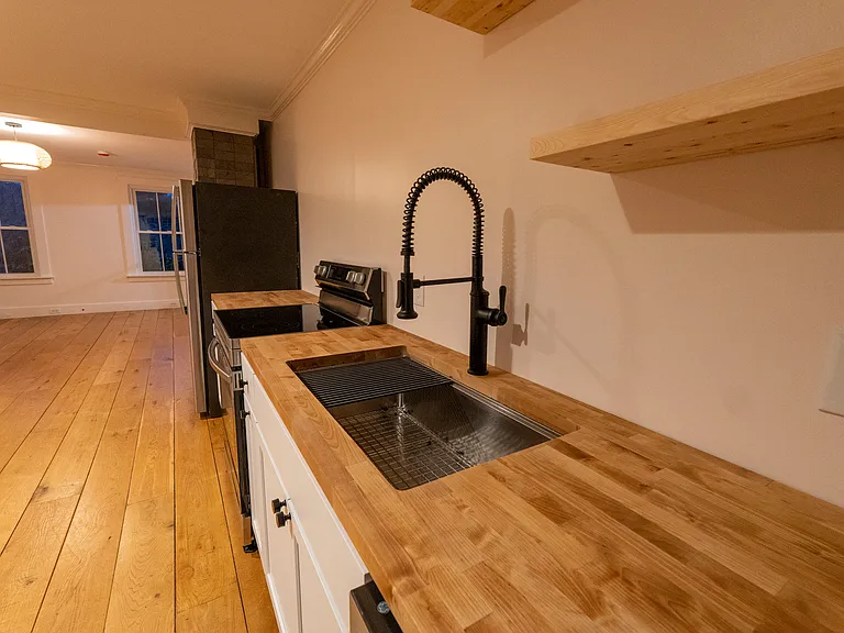 Stainless steel sink and ample counter space for all your cooking needs.