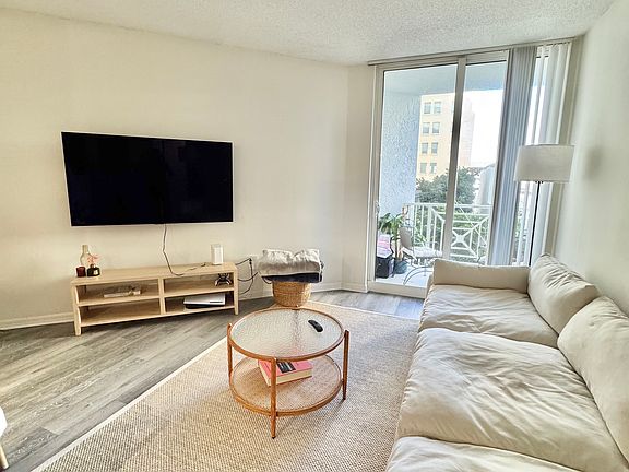 Living Room opens out to a balcony facing the pool