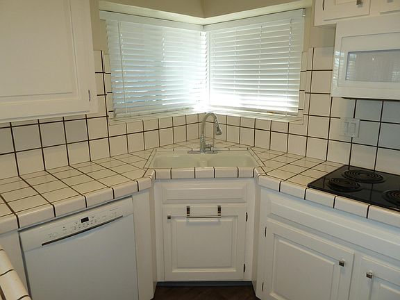 Upgraded kitchen with Shaker style cabinetry, newer appliances & Vinyl Plank Flooring.