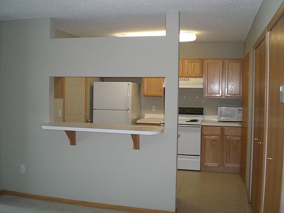Bright kitchen with ceramic tile floor (1/2 bath off of kitchen area)