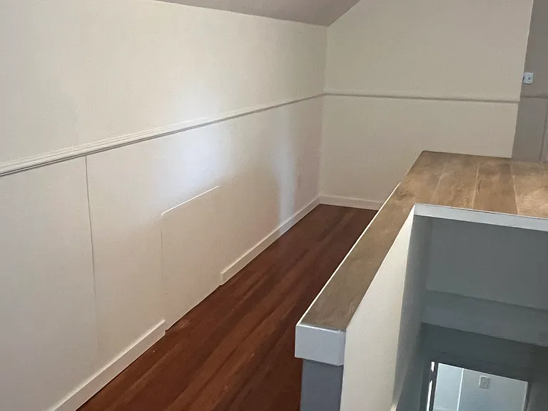 upstairs bonus room (with knee wall around stairwell)
