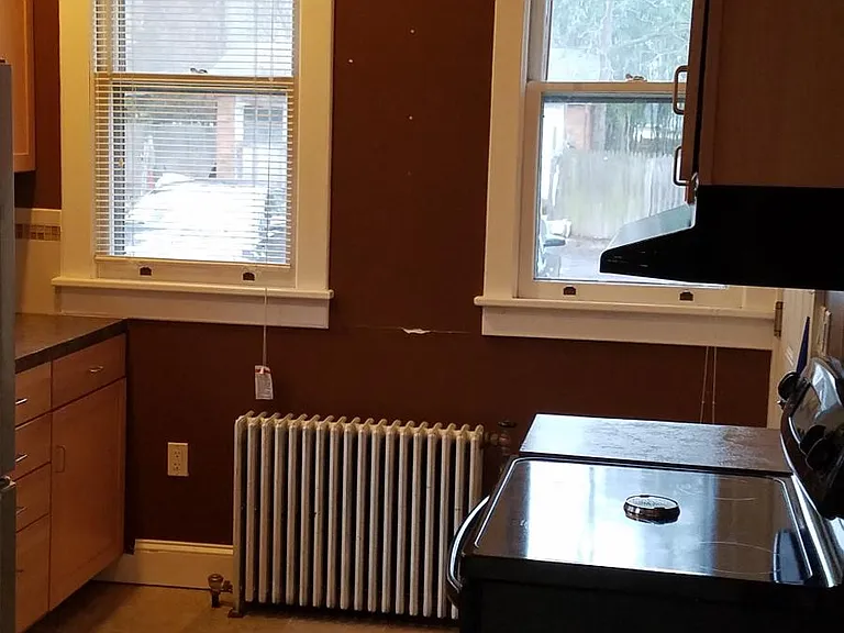 Kitchen has lots of windows.
