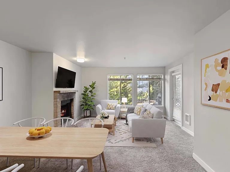 Enjoy a living room designed for both comfort and charm, with expansive windows that flood the space with natural light.