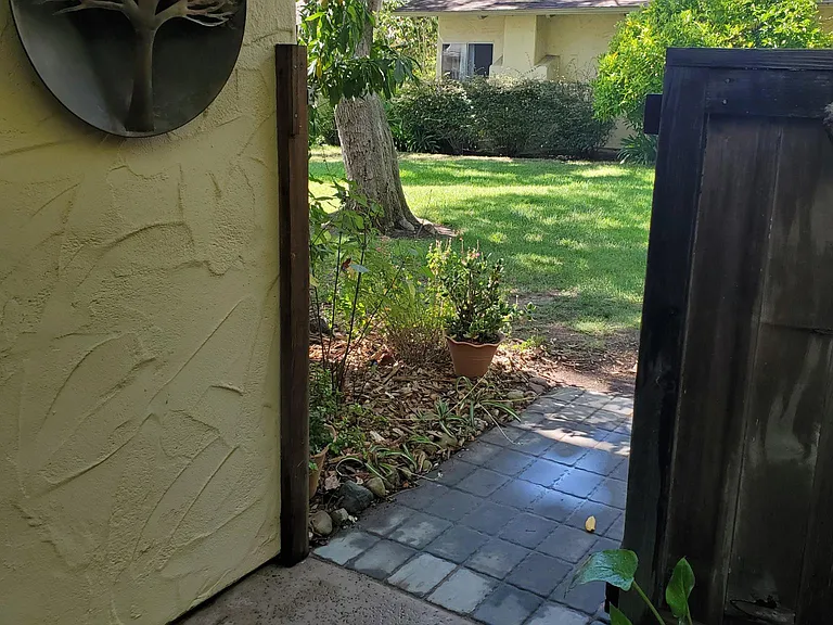 Private gate leading to common grass area