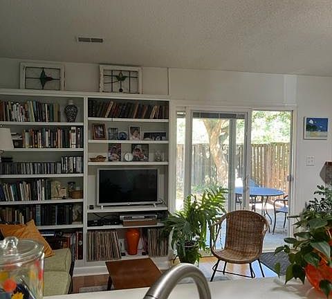 light-filled, open floor plan, book shelves