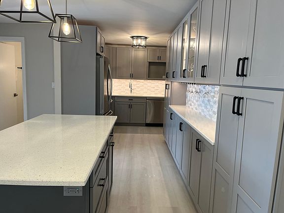 Kitchen on right after you walk into apartment.