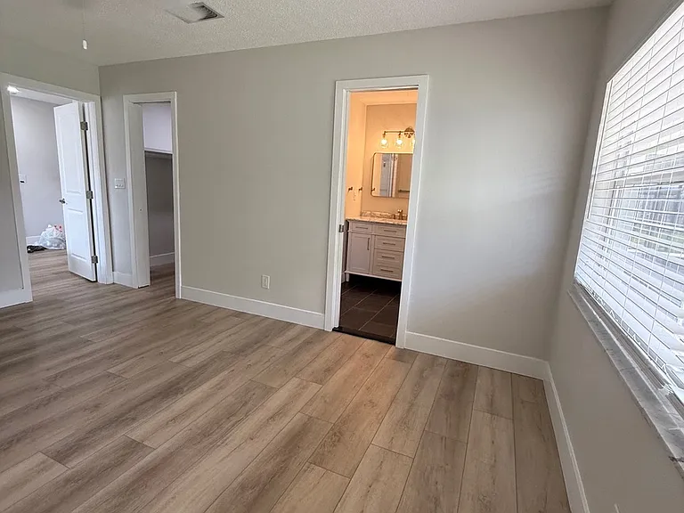 Primary Bedroom, walk in closet to left, full bathroom with shower to right