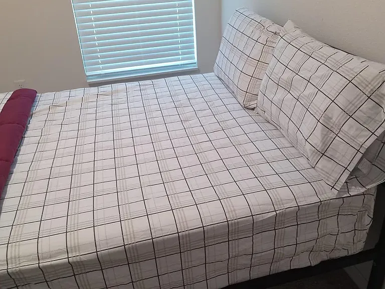 Private bedroom featuring a furnished bed with Ralph Lauren bedding
