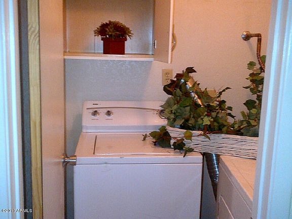 Includes full laundry washer and dryer