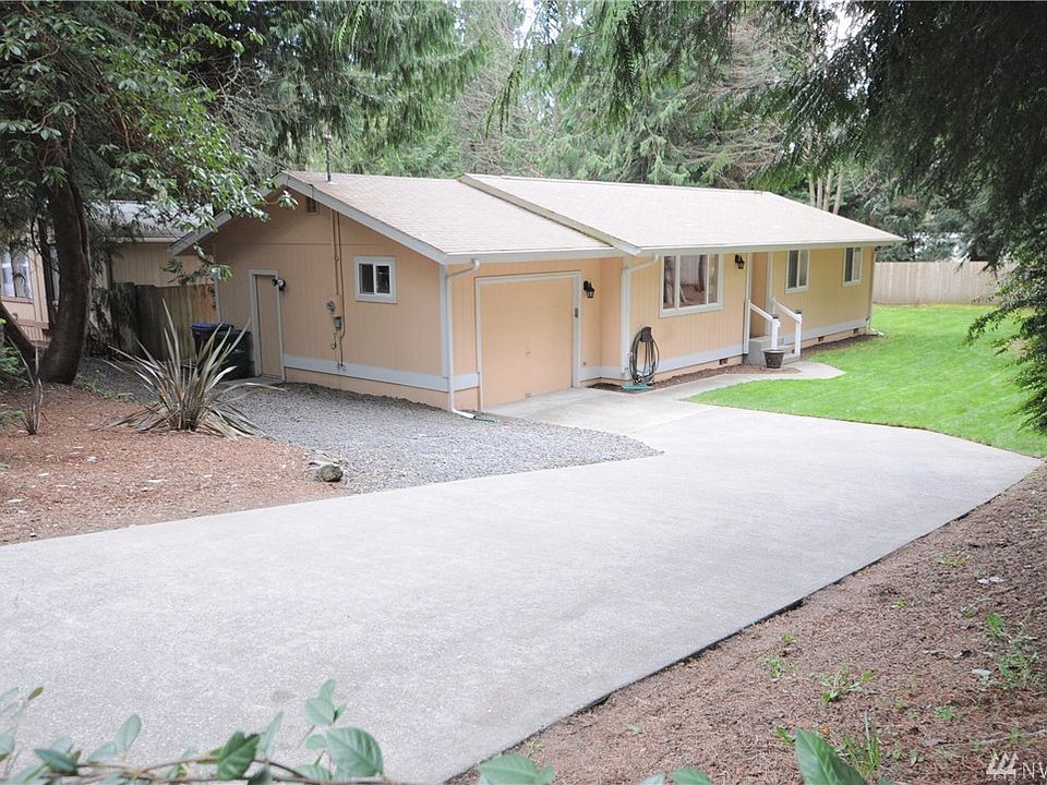 Welcome to your private oasis in this stick built home tucked near the back of Miller Bay Estates