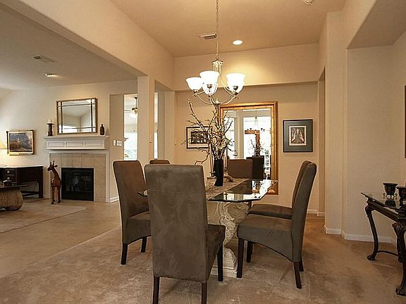 THIS STUNNING FORMAL DINING ROOM IS SET OFF BY 2 WIDE ARCHWAYS AND A FRAMED OPEN NICHE.  IT ALSO FEATURES A LARGE DEEP RECESSED NICHE FOR A CHINA CABINET OR ART WORK.  THE CERAMIC TILE ENTRY & GALLERY WALKWAY BORDER THE DINING ROOM .