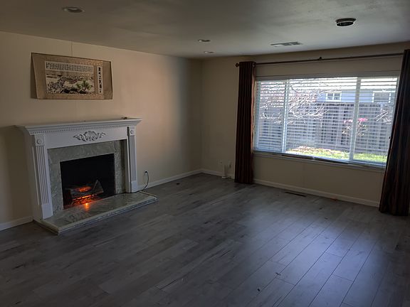 Living room with a few to the backyard