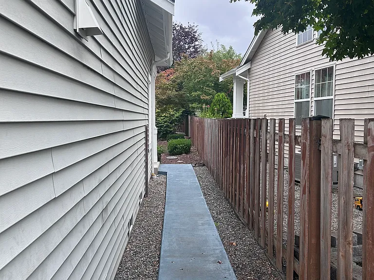 Side of home leading to backyard