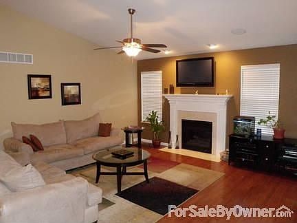 Living Room : Gas fireplace, vaulted ceilings, and built in surround sound speakers.