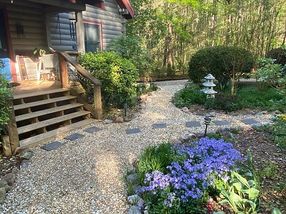 Smaller of the 2 covered entry porches and the front flower garden