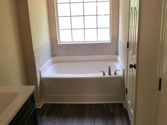 Master Bath Garden Tub. Includes a separate shower also.
