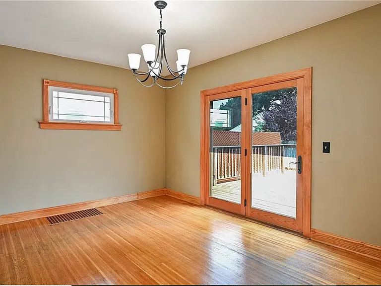 Dining Room leads to Deck and Backyard