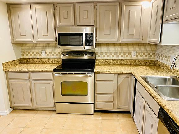 Spacious kitchen with stainless appliances and ample pantry