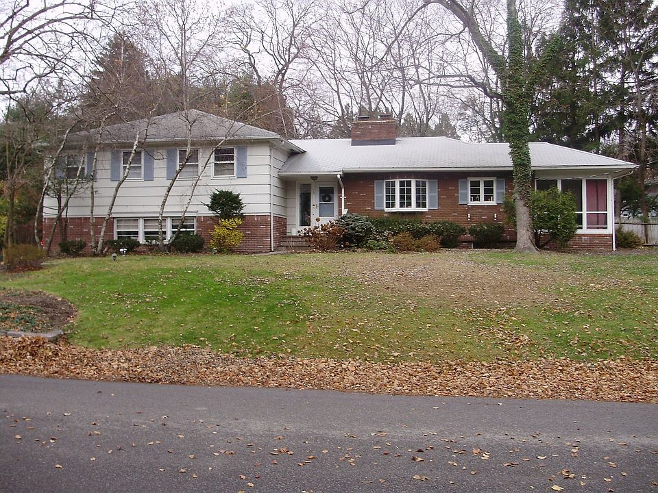Front Elevation of home with screened-in porch.