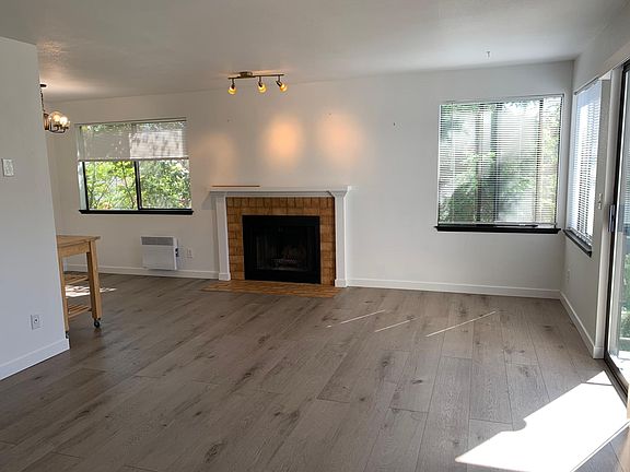 View taken from hallway to bedrooms.
sliding door to deck is to the right. Kitchen to the left