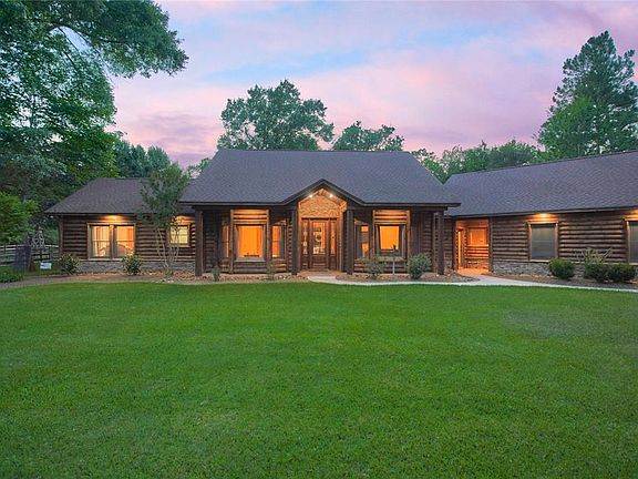 This magnificent Custom Equestrian Estate is located in the Private Gated Community of Millers Crossing! It offers you the best of both worlds. Private country surrounds but steps away from everything such as The Woodlands!
