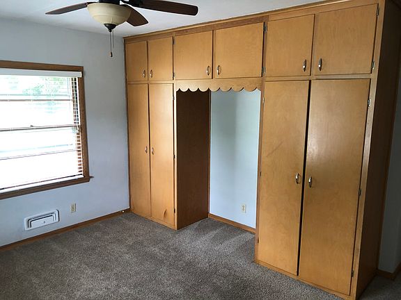 Bedroom has ample storage and desk alcove