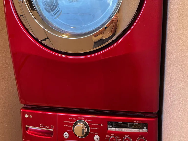 Stackable washer and dryer in studio.