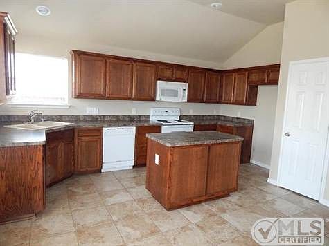 The kitchen is a dream with lots of counter space, storage & an