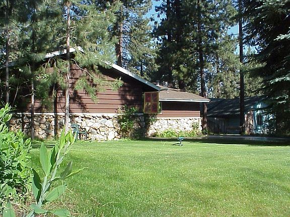 Well-kept lawns front and back