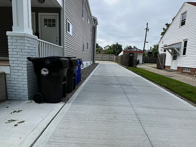 Shared driveway leads to private off-street parking.