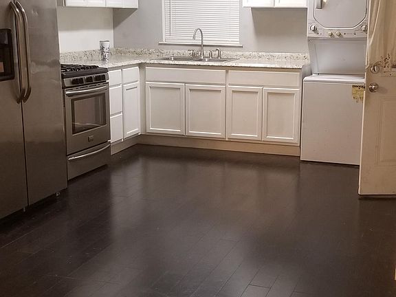 Living room looking into kitchen. Bamboo floors throughout