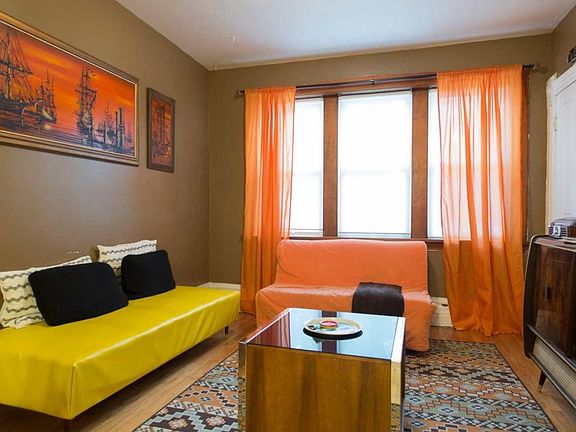 staged photo of living room - room has since been painted / renovated