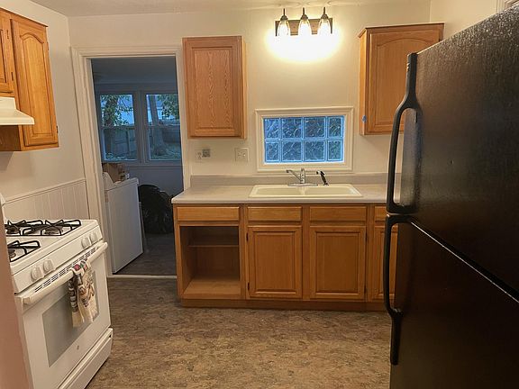 Kitchen pictured from living room entrance.