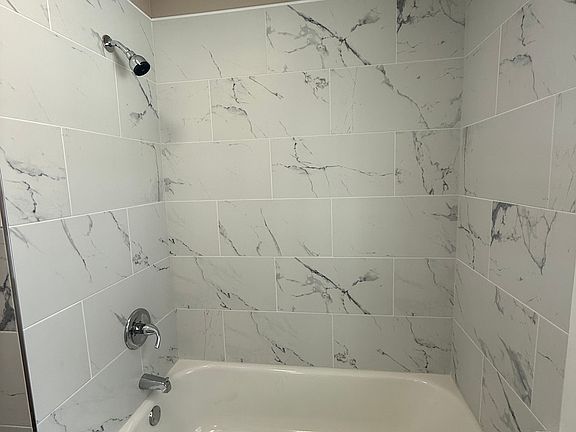 Brand new tub and tiles