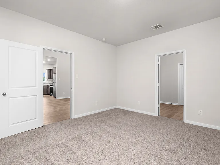 The master suite has a large bedroom, ensuite bathroom and a walk-in closet.