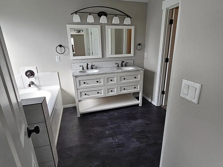 Remodeled master bathroom with oversized shower, soaker tub and new flooring