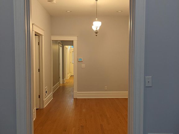 In living room looking into dining room and back hallway