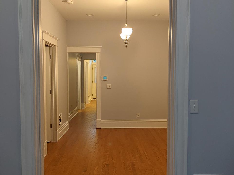 In living room looking into dining room and back hallway