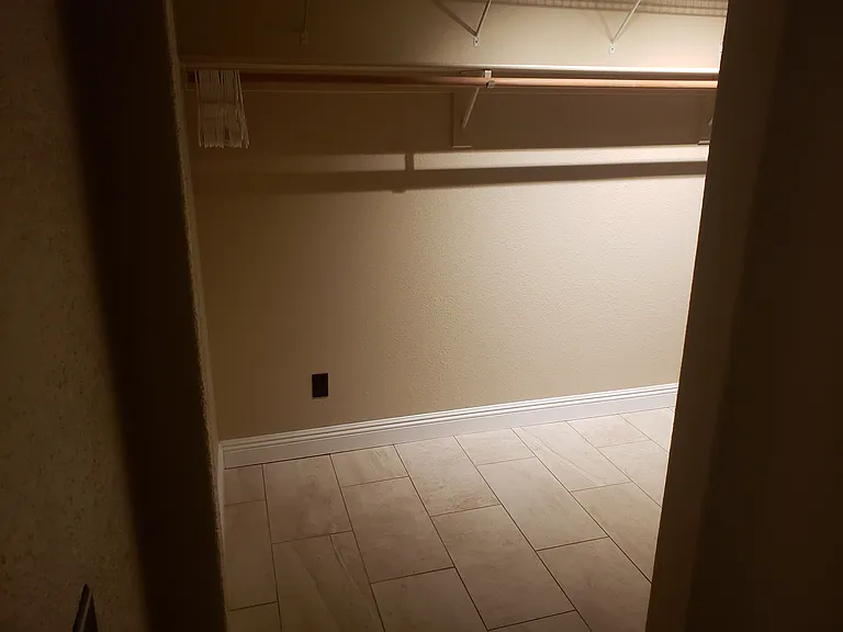 Large walk-in closet in primary bedroom.