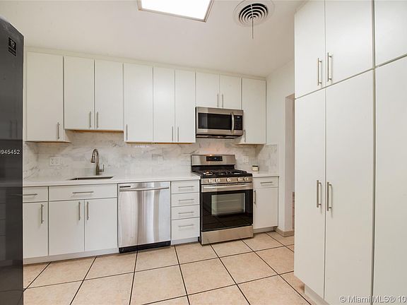 Kitchen with gas oven and range and loads of cabinets.  All new and stainless appliances 