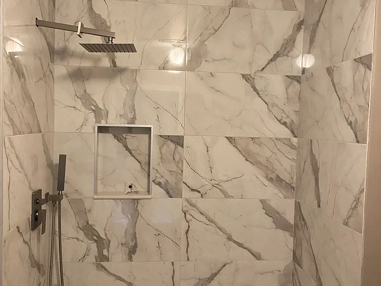 Newer tiled shower in one of two upstairs bathrooms.