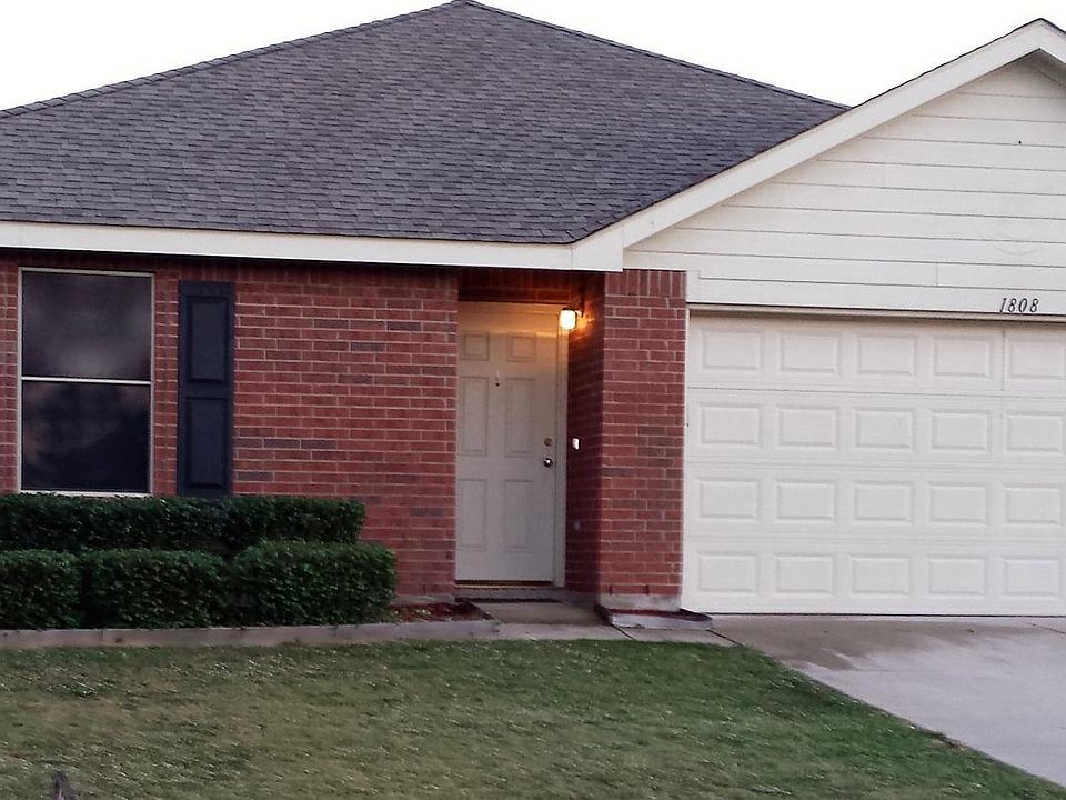 Front of House - Brick Home with Solar Screens, 2 car garage