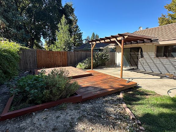 Back yard - gardening bed, deck and patio