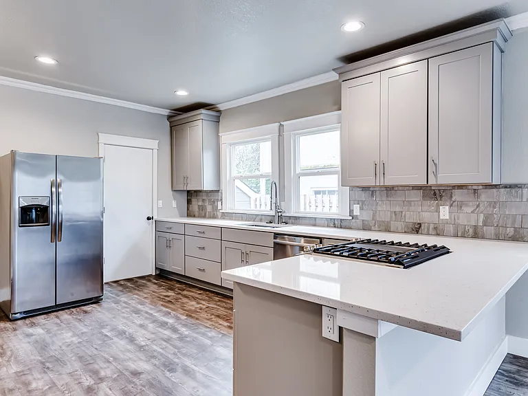 Gas range for cooking and a proper fridge offering great amounts of food storage.