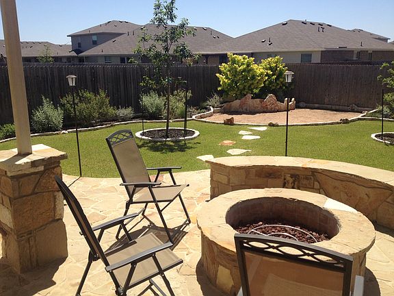 Rock fire pit and flow beds
