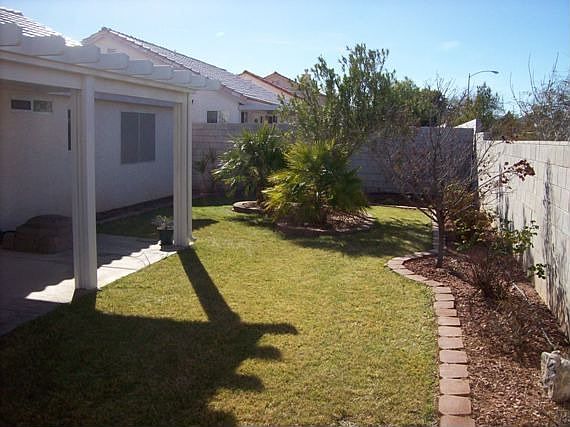 Landscaped Yard with Covered Patio