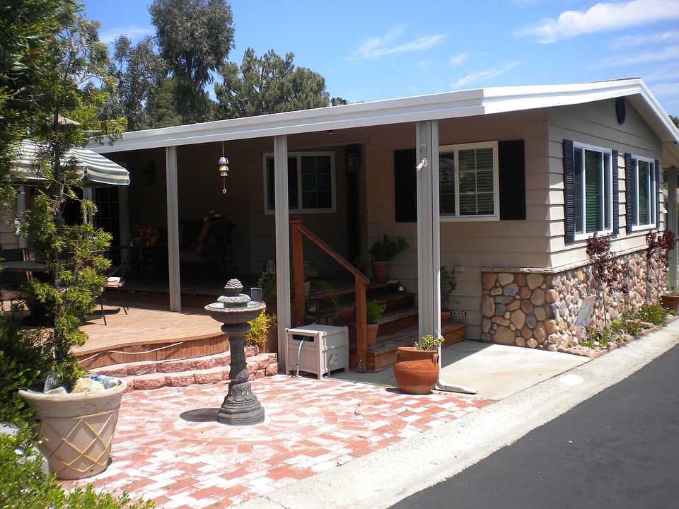 Beautiful fountain, wooden deck, and bbq area.