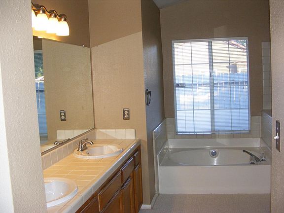 Master bathroom. This picture shows carpet which has been replaced with wood look planks.