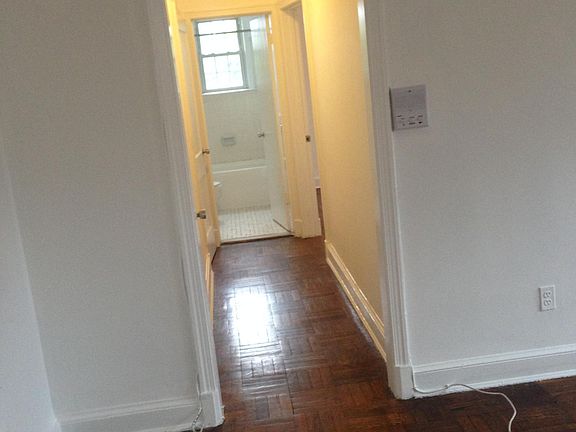 Hallway opposite entry door leads to bedroom and bath. Large closet and smaller coat closet with overhead shelves located on left wall of hallway.