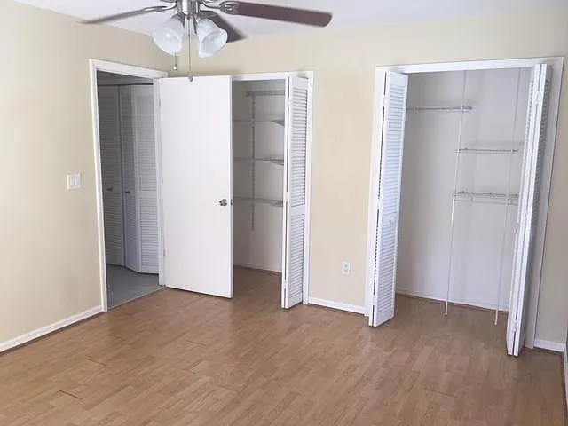 third bedroom with plenty of closets